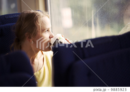 Pensive woman traveling by train 9885923
