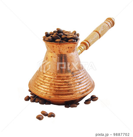 Cezve and freshly roasted coffee, isolation Cezve and freshly roasted coffee, isolation 9887702