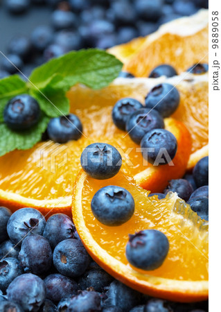 Freshly picked blueberries with orange Freshly picked blueberries with orange 9889058