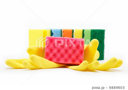 Rubber gloves and a cleaning sponges on a white background. Rubber gloves and a cleaning sponges on a white background. 9889603