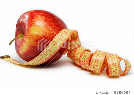Red apple and measuring tape on a white background. Red apple and measuring tape on a white background. 9889604