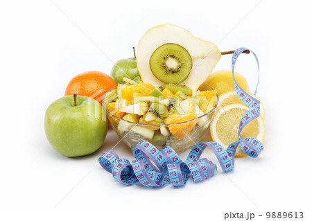 Fresh fruits and salad isolated on a white background. 9889613