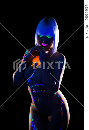 Curvy girl posing nude with glowing design on body 9890932