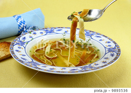 Pancake soup in blue plate, eating Pancake soup in blue plate, eating 9893536