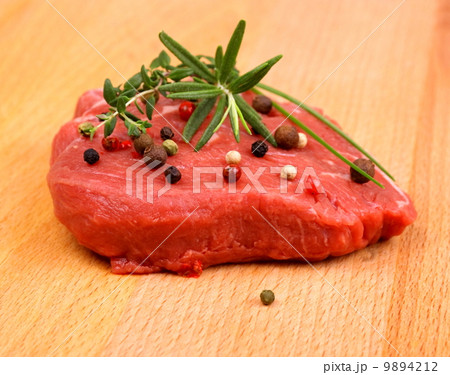 Juicy beef steak with spices and herbs 9894212