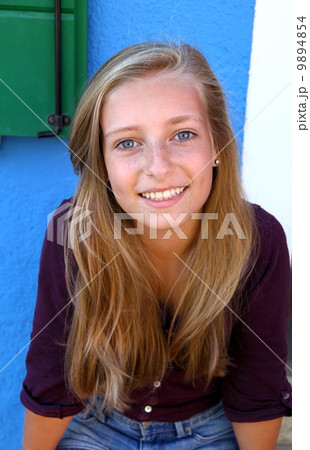 Cute blond girl with blue eyes smiling Cute blond girl with blue eyes smiling 9894854