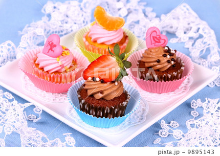 Assorted cup cakes with angel, heart, tangerine, strawberry 9895143