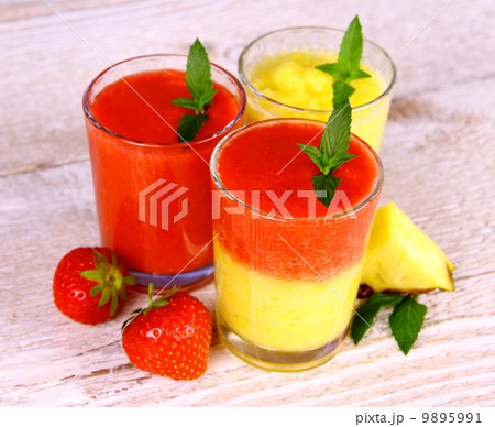 Strawberry and pineapple smoothie in glass mixed Strawberry and pineapple smoothie in glass mixed 9895991