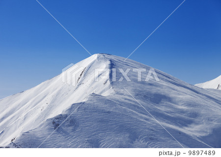 Off piste slope at sun day Off piste slope at sun day 9897489