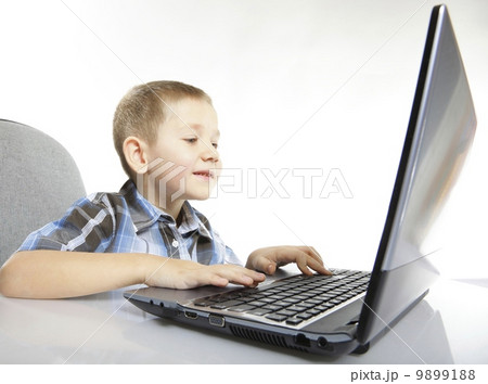 Computer addiction child with laptop notebook 9899188