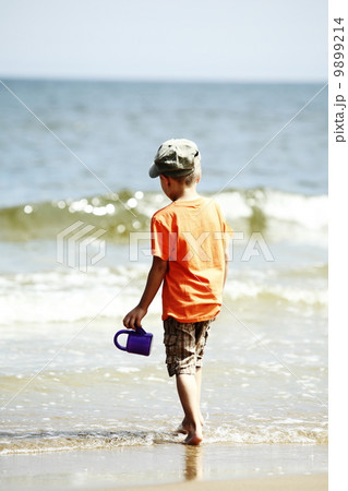 boy playing toys on beach boy playing toys on beach 9899214