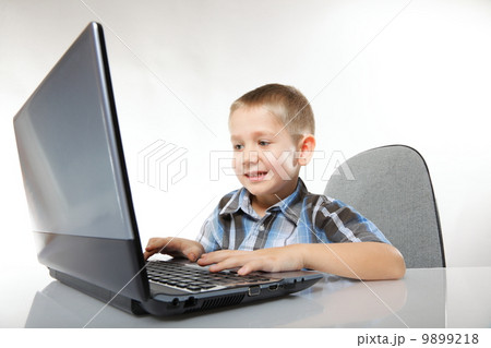 Computer addiction emotional boy with laptop Computer addiction emotional boy with laptop 9899218
