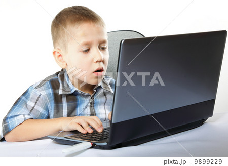 Computer addiction child with laptop notebook 9899229
