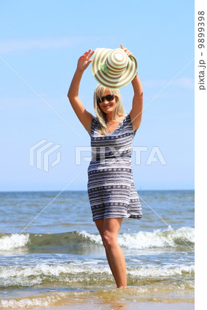 mature woman on beach summer holiday mature woman on beach summer holiday 9899398