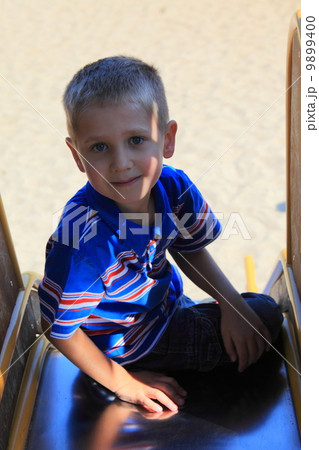 child in playground, kid in action playing child in playground, kid in action playing 9899400