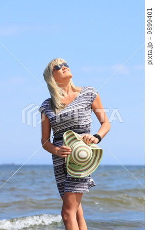 mature woman on beach summer holiday mature woman on beach summer holiday 9899401