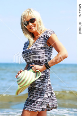 mature woman on beach summer holiday mature woman on beach summer holiday 9899489
