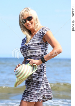 mature woman on beach summer holiday 9899566