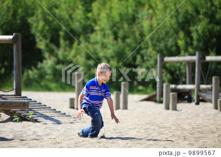 child in playground, kid in action playing child in playground, kid in action playing 9899567