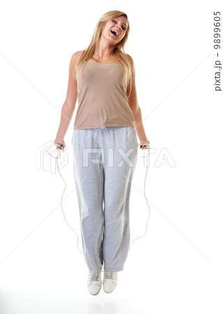 young fitness woman with jump rope isolated young fitness woman with jump rope isolated 9899605