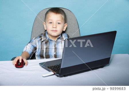 Computer addiction child with laptop notebook Computer addiction child with laptop notebook 9899683