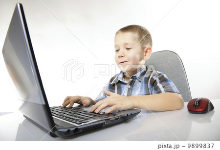 Computer addiction child with laptop notebook 9899837