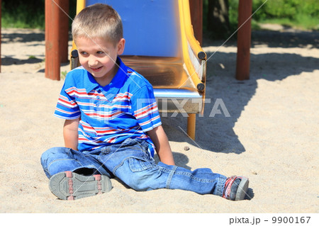 child boy or kid playing on playground child boy or kid playing on playground 9900167
