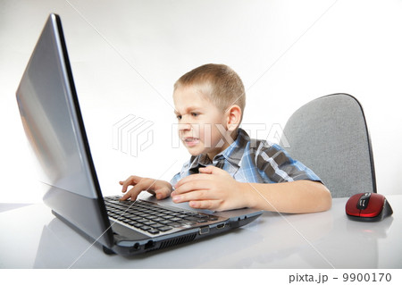 Computer addiction emotional boy with laptop Computer addiction emotional boy with laptop 9900170