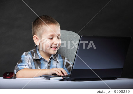 Computer addiction child with laptop notebook 9900229