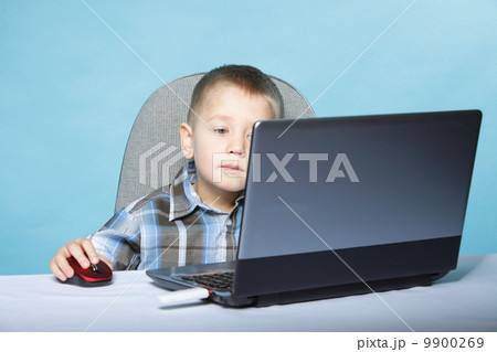 Computer addiction child with laptop notebook 9900269