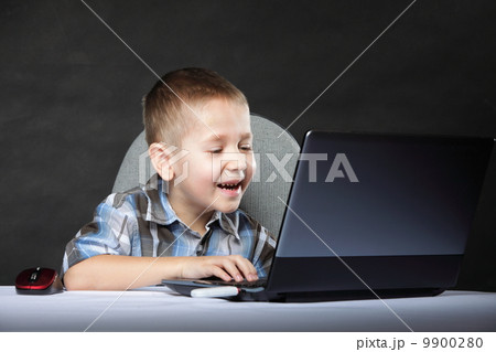 Computer addiction child with laptop notebook 9900280
