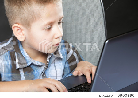 Computer addiction child with laptop notebook 9900290