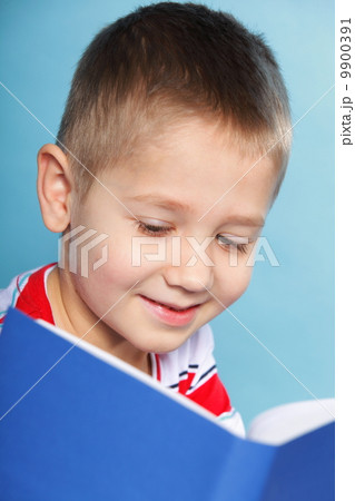 child boy kid reading a book on blue 9900391