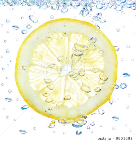 Lemon in a liquid with bubbles. On a white background. Lemon in a liquid with bubbles. On a white background. 9901693
