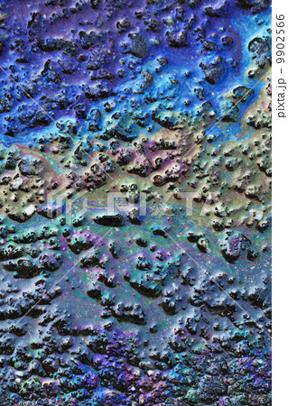 Color gasoline fuel spot on black asphalt 9902566