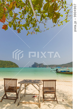 table and chairs on beautiful bay of Koh Phi Phi table and chairs on beautiful bay of Koh Phi Phi 9904907