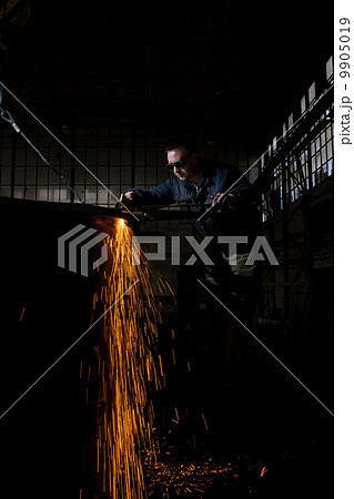 Welder working at the factory 9905019