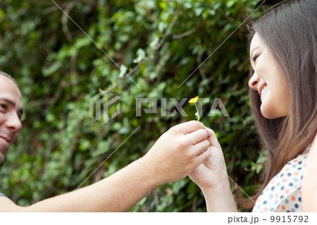 Man Gives His Wife a Flower Man Gives His Wife a Flower 9915792