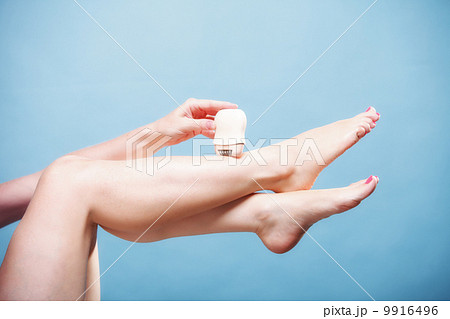 woman shaving leg with shaver depilation body care 9916496