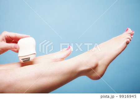 woman shaving leg with shaver depilation body care woman shaving leg with shaver depilation body care 9916945