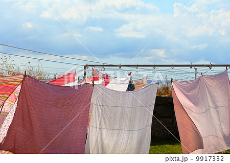 clothes hanging to dry on a laundry line 9917332