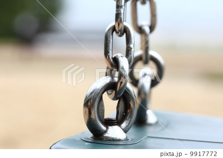 Empty swing set on playground 9917772