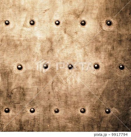 Grunge gold brown metal plate rivets screws background texture Grunge gold brown metal plate rivets screws background texture 9917794