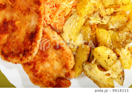 Fried chicken roasted potatos and carrot salad Fried chicken roasted potatos and carrot salad 9918333