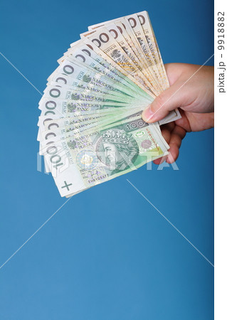 Businessman holding money polish banknote Businessman holding money polish banknote 9918882