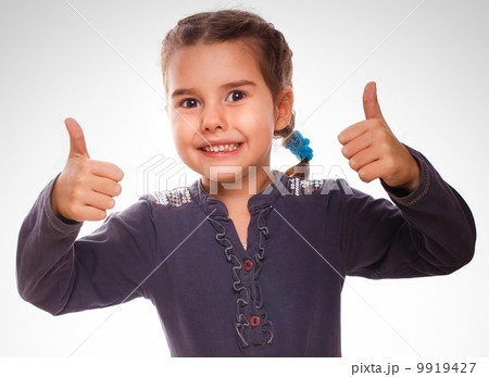 girl baby raised her thumbs up isolated smiling symbol indicates 9919427