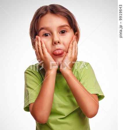 Portrait of cute little girl child childhood fun showing tongue 9919643