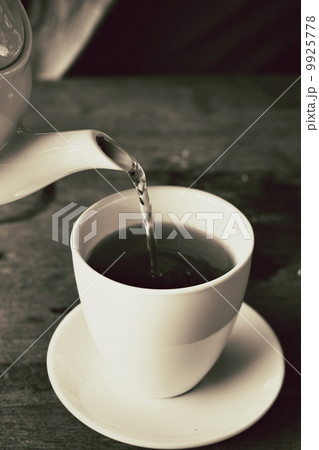 Hot tea on the wood background 9925778