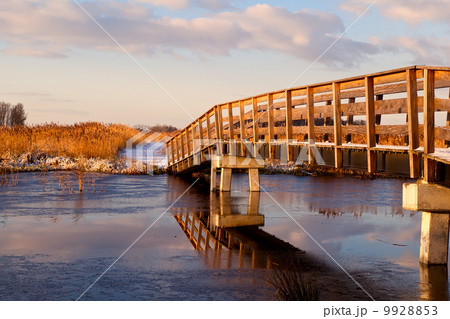 wooden bridge over river 9928853