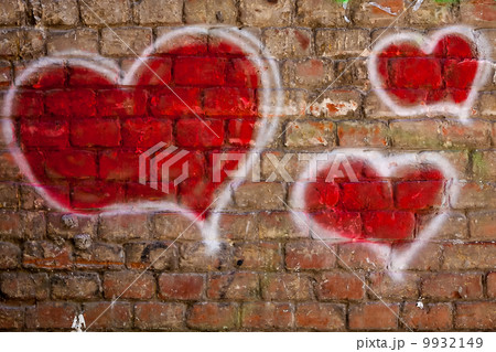 red hearts painted on a brick wall red hearts painted on a brick wall 9932149